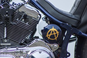 Oil tank with logo of anarchy and ignition switch bracket